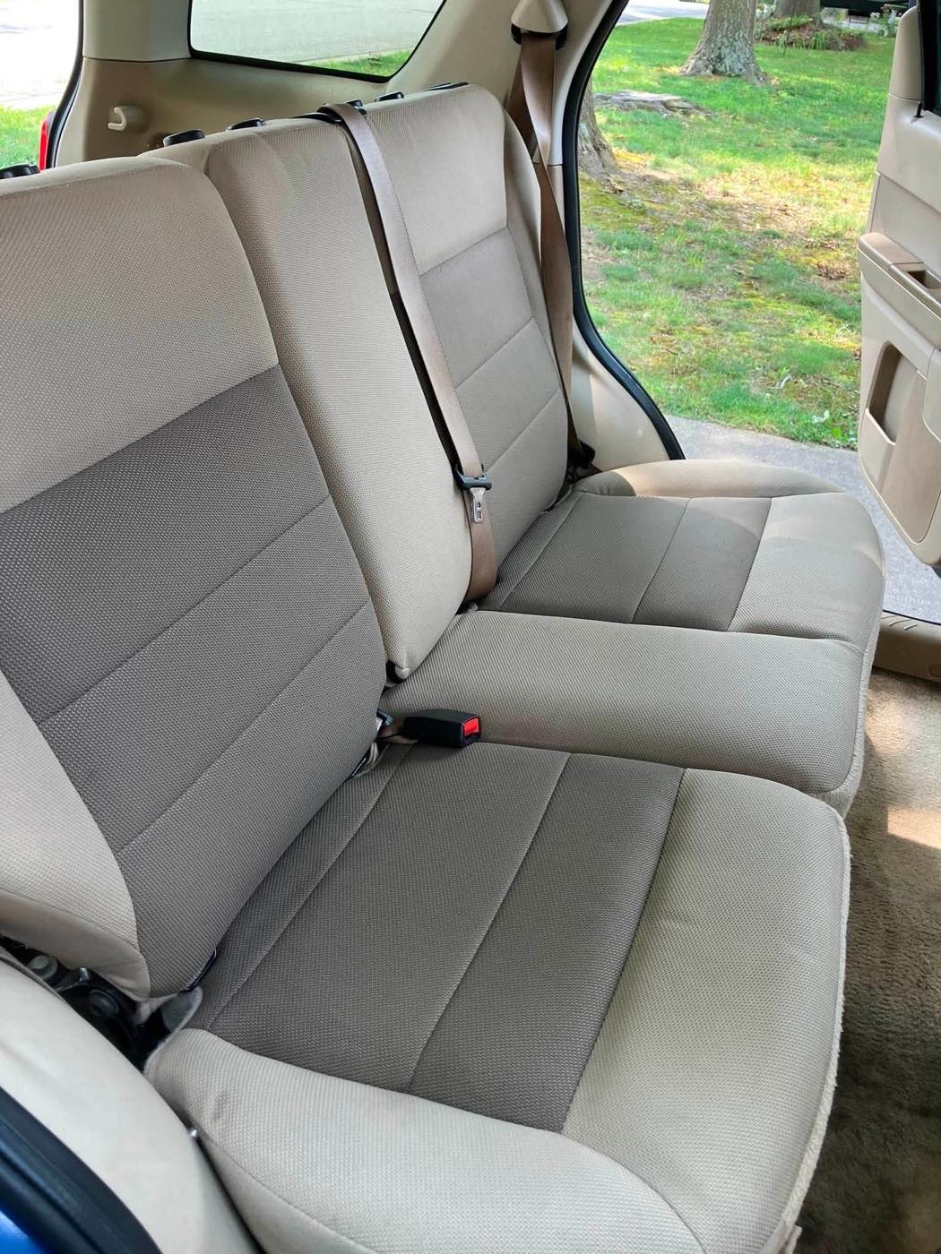 Tan cloth rear bench after detailing, clean